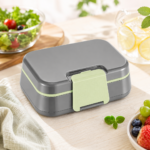 Green two-layer bento lunch box with carrying handle and 1145 ml capacity